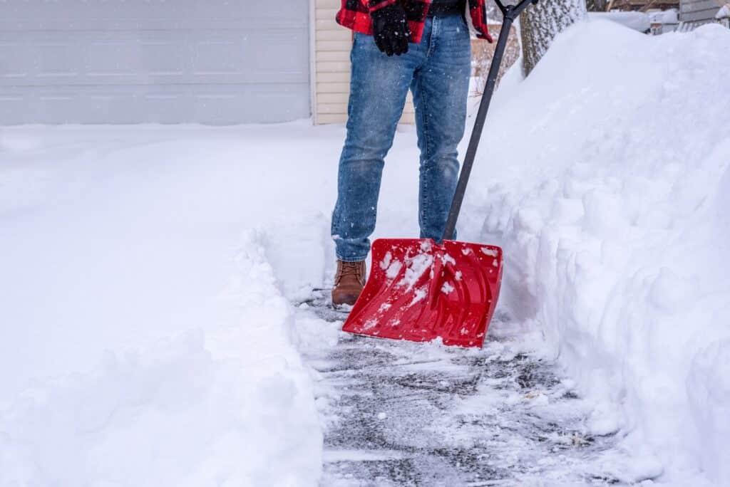 Man shoveling snow after a winter storm